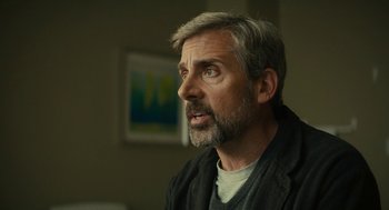 Movie still from “Beautiful Boy” (2018), directed by Felix van Groeningen – A person with a gray beard; Close Up shot, Over the shoulder angle