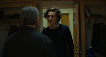 Movie still from “Beautiful Boy” (2018), directed by Felix van Groeningen – A man standing in front of a mirror talking to another man; Medium shot, Over the shoulder angle