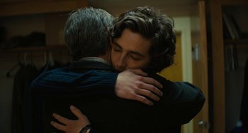 Movie still from “Beautiful Boy” (2018), directed by Felix van Groeningen – Two people hugging each other in a room; Close Up shot, Over the shoulder angle