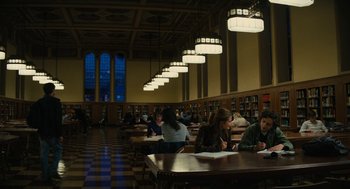 Movie still from “Beautiful Boy” (2018), directed by Felix van Groeningen – A group of people sitting at a table in a library; Extreme Wide shot, High angle