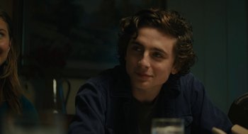 Movie still from “Beautiful Boy” (2018), directed by Felix van Groeningen – A young man sitting in front of a table; Close Up shot, Over the shoulder angle