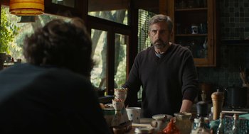 Movie still from “Beautiful Boy” (2018), directed by Felix van Groeningen – An older man sitting at a table with a bowl of food in front of him; Medium shot, Over the shoulder angle