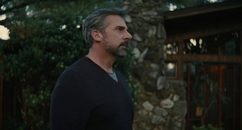 Movie still from “Beautiful Boy” (2018), directed by Felix van Groeningen – A person standing near a building; Close Up shot, Low angle