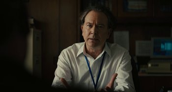 Movie still from “Beautiful Boy” (2018), directed by Felix van Groeningen – An older man is sitting at a table; Close Up shot, Over the shoulder angle