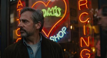 Movie still from “Beautiful Boy” (2018), directed by Felix van Groeningen – A man standing in front of a store with neon lights; Close Up shot, Over the shoulder angle