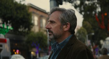 Movie still from “Beautiful Boy” (2018), directed by Felix van Groeningen – A person wearing a jacket on a city street; Close Up shot, Over the shoulder angle