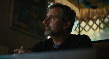 Movie still from “Beautiful Boy” (2018), directed by Felix van Groeningen – A person sitting at a table; Close Up shot, Low angle
