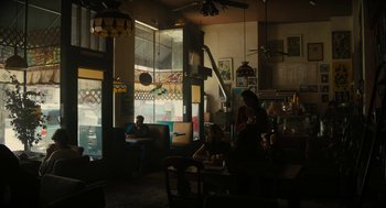 Movie still from “Beautiful Boy” (2018), directed by Felix van Groeningen – People are sitting at tables in a restaurant; Extreme Wide shot, High angle