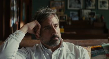 Movie still from “Beautiful Boy” (2018), directed by Felix van Groeningen – A person sitting on a couch with his hand on his head; Close Up shot, Low angle