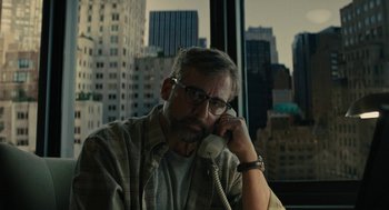 Movie still from “Beautiful Boy” (2018), directed by Felix van Groeningen – A man sitting at a table talking on the phone; Close Up shot, Low angle