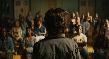 Movie still from “Beautiful Boy” (2018), directed by Felix van Groeningen – A group of people sitting in front of a man; Wide shot, Over the shoulder angle