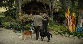 Movie still from “Beautiful Boy” (2018), directed by Felix van Groeningen – Two men and two dogs in front of a house; Wide shot, Over the shoulder angle