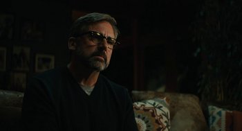 Movie still from “Beautiful Boy” (2018), directed by Felix van Groeningen – A person wearing glasses sitting on a couch; Close Up shot, Low angle