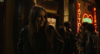 Movie still from “Beautiful Boy” (2018), directed by Felix van Groeningen – A woman in a leather jacket smiling for the camera; Close Up shot, Over the shoulder angle
