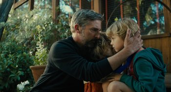 Movie still from “Beautiful Boy” (2018), directed by Felix van Groeningen – A man and two children are hugging each other; Medium shot, Over the shoulder angle