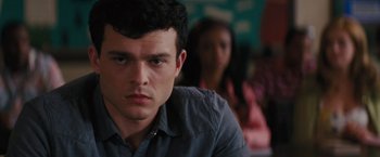 Movie still from “Beautiful Creatures” (2013), directed by Richard LaGravenese – A man sitting in front of a woman in a room; Close Up shot, Over the shoulder angle