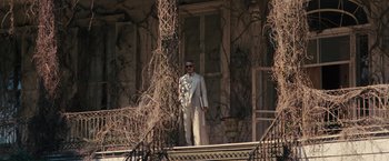 Movie still from “Beautiful Creatures” (2013), directed by Richard LaGravenese – A man standing on the steps of an old house; Wide shot, Low angle