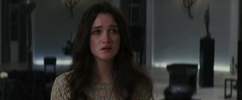Movie still from “Beautiful Creatures” (2013), directed by Richard LaGravenese – A woman with long brown hair looking sad; Close Up shot, Over the shoulder angle
