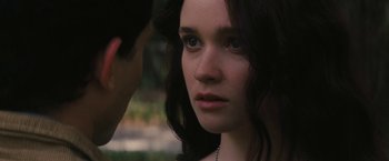 Movie still from “Beautiful Creatures” (2013), directed by Richard LaGravenese – A young woman looking at the camera while a man looks at her face; Close Up shot, Over the shoulder angle