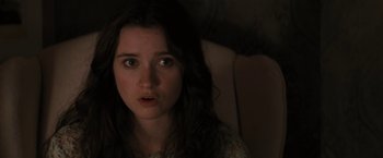 Movie still from “Beautiful Creatures” (2013), directed by Richard LaGravenese – A young woman stares into the camera with her eyes wide open; Close Up shot, Over the shoulder angle