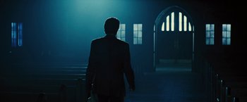 Movie still from “Beautiful Creatures” (2013), directed by Richard LaGravenese – A man in a suit walking down a dark hallway; Wide shot, Low angle
