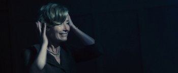 Movie still from “Beautiful Creatures” (2013), directed by Richard LaGravenese – A woman in a black shirt is smiling at the camera; Close Up shot, Over the shoulder angle