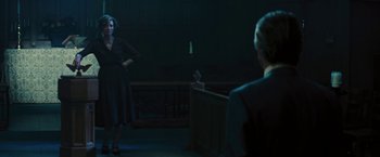 Movie still from “Beautiful Creatures” (2013), directed by Richard LaGravenese – A woman standing in front of a judge in a courtroom; Wide shot, Over the shoulder angle