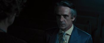 Movie still from “Beautiful Creatures” (2013), directed by Richard LaGravenese – A person wearing a suit and tie; Close Up shot, Over the shoulder angle