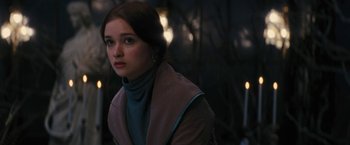 Movie still from “Beautiful Creatures” (2013), directed by Richard LaGravenese – A young woman is looking into the distance; Close Up shot, Over the shoulder angle