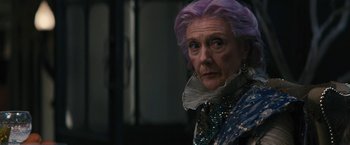 Movie still from “Beautiful Creatures” (2013), directed by Richard LaGravenese – An older woman with purple hair looking at the camera; Close Up shot, Over the shoulder angle