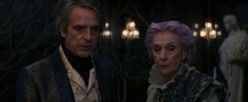 Movie still from “Beautiful Creatures” (2013), directed by Richard LaGravenese – A man and a woman standing next to each other; Close Up shot, Low angle