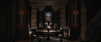 Movie still from “Beautiful Creatures” (2013), directed by Richard LaGravenese – A woman standing in front of an organ in a room; Wide shot, High angle