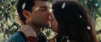 Movie still from “Beautiful Creatures” (2013), directed by Richard LaGravenese – A man and a woman are kissing in the sunlight; Close Up shot, Low angle