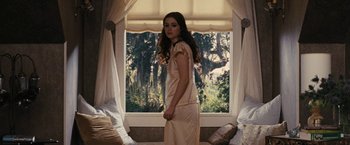Movie still from “Beautiful Creatures” (2013), directed by Richard LaGravenese – A woman standing in front of a large window; Medium shot, Over the shoulder angle