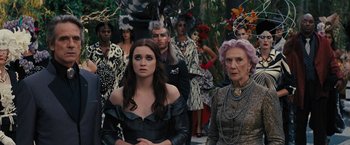 Movie still from “Beautiful Creatures” (2013), directed by Richard LaGravenese – A group of people standing next to each other in costumes; Medium shot, High angle