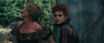 Movie still from “Beautiful Creatures” (2013), directed by Richard LaGravenese – A woman with red curly hair looking into a mirror; Close Up shot, Over the shoulder angle