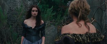 Movie still from “Beautiful Creatures” (2013), directed by Richard LaGravenese – A woman standing in front of a mirror looking at herself in the mirror; Medium shot, Over the shoulder angle