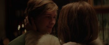Two women are looking at each other in the dark