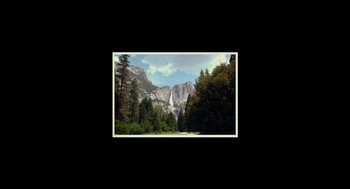 Movie still from “Beginners” (2010), directed by Mike Mills – A view of a waterfall from the side of a mountain; Extreme Wide shot, Low angle