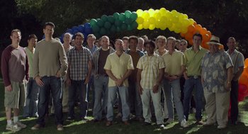 Movie still from “Beginners” (2010), directed by Mike Mills – A large group of men standing in front of balloons; Wide shot, High angle