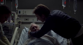 Movie still from “Beginners” (2010), directed by Mike Mills – An older man laying in a hospital bed with a younger man; Close Up shot, Over the shoulder angle