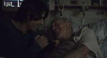 Movie still from “Beginners” (2010), directed by Mike Mills – An older man in a hospital bed with a young woman; Close Up shot, Over the shoulder angle