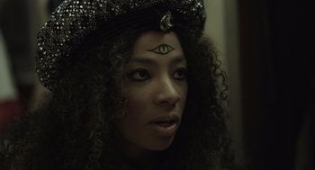 Movie still from “Beginners” (2010), directed by Mike Mills – A person wearing a hat with an eye on it; Close Up shot, High angle