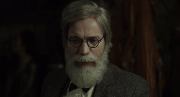 Movie still from “Beginners” (2010), directed by Mike Mills – An old man with a beard wearing a suit; Close Up shot, High angle