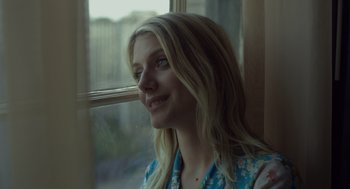 Movie still from “Beginners” (2010), directed by Mike Mills – A woman sitting in front of a window; Close Up shot, Low angle