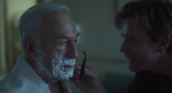 Movie still from “Beginners” (2010), directed by Mike Mills – An older man getting his beard shaved by a barber; Close Up shot, Over the shoulder angle