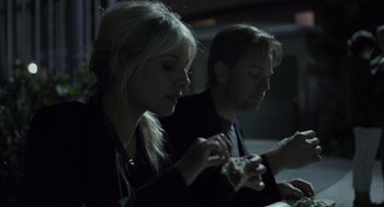 Movie still from “Beginners” (2010), directed by Mike Mills – A man and a woman sitting at a dinner table; Close Up shot, Over the shoulder angle