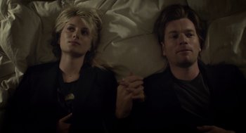 Movie still from “Beginners” (2010), directed by Mike Mills – A man and a woman laying in bed next to each other; Close Up shot, Overhead angle