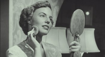 Movie still from “Beginners” (2010), directed by Mike Mills – An old photo of a woman looking in the mirror; Close Up shot, Over the shoulder angle