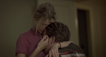 Movie still from “Beginners” (2010), directed by Mike Mills – A man and a woman hugging in a room; Close Up shot, Over the shoulder angle